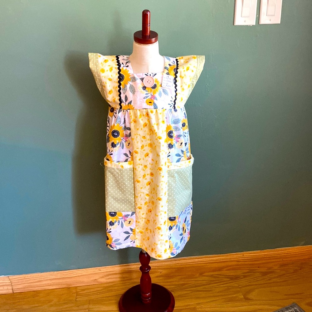 Unique handmade girls dress, coordinated fabrics, embellishments, pockets,